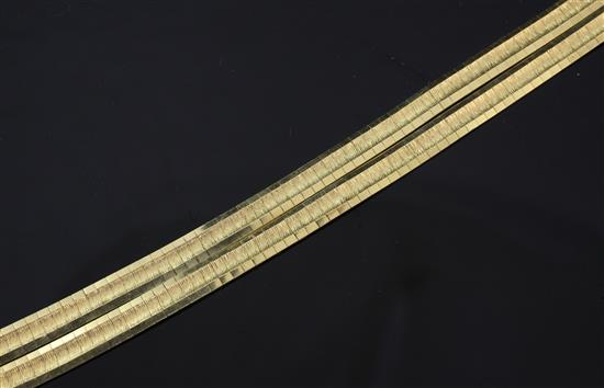 An Italian 18ct gold twin strand articulated link bracelet, 7.5in.